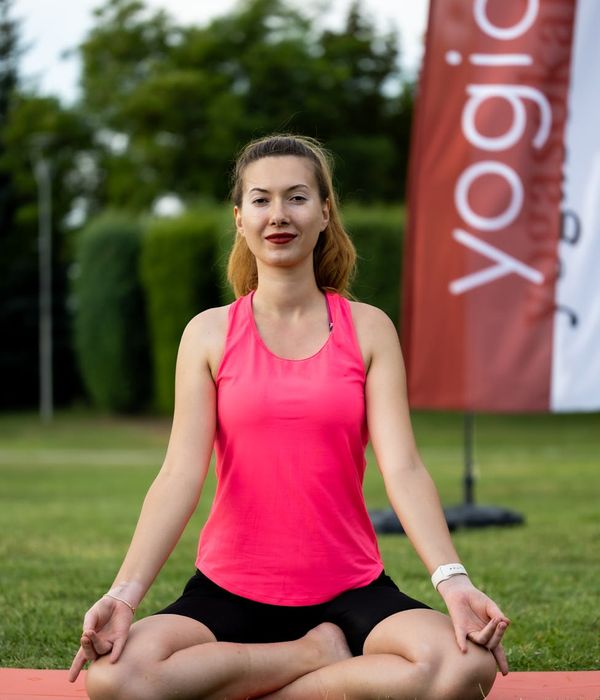 Woman in a calm yoga pose, embodying inner harmony and balance.